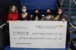5 people holding oversized check